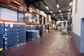 Wine factory, production room, warehouse, shelving, shelves with boxes, empty wine bottles in the package. The concept of the