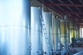 Wine Fermenting in huge vats in a famous wine cellar. Ground level