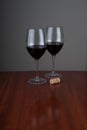 Wine glases on glossy woden background