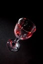 Wine glass with beautiful red glares