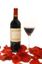 Wine glass, bottle and rose petals