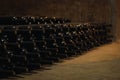 Wine glass bottles fermenting in winery cellar