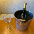 Wine glass and bucket of ice down wine Royalty Free Stock Photo