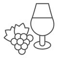 Wine glass and a bunch of grapes thin line icon. Full wineglass and grape with leaf outline style pictogram on white Royalty Free Stock Photo