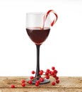 Wine glass with candy cane Royalty Free Stock Photo