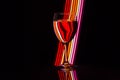 Wine glass with neon light behind