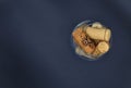 Wine glass full of many corks taken from above Royalty Free Stock Photo