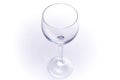 Wine glass glitters in the sun top view close-up on a white background Royalty Free Stock Photo