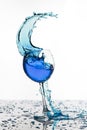 Wine glass with liquid splash on white Royalty Free Stock Photo