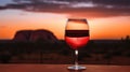 Wine glass with red wine at sunset. Australian wine concept.