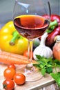 Wine glass red vegetable fresh food garlic tomato carrots onion pepper Royalty Free Stock Photo