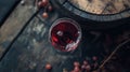 Wine glass of ruby red wine, rustic wooden surface Royalty Free Stock Photo