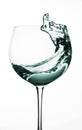 Wine glass, splash of water on a white background isolated Royalty Free Stock Photo