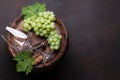 Wine glass and white grape on old barrel Royalty Free Stock Photo