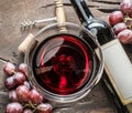 Wine glass, wine bottle and grapes on wooden background. Wine ta Royalty Free Stock Photo