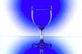 Wine glasses in backlight on the blue and white Royalty Free Stock Photo