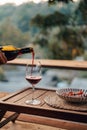 Wine glasses and bottles on a restaurant table, reflecting a celebratory dinner scene with red and white wine, creating a perfect