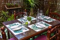 Wine glasses and dishes set on a dinner table Royalty Free Stock Photo