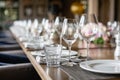Wine glasses in the foreground. Wedding Banquet or gala dinner. The chairs and table for guests, served with cutlery and Royalty Free Stock Photo
