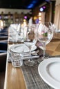 Wine glasses in the foreground. Wedding Banquet or gala dinner. The chairs and table for guests, served with cutlery and Royalty Free Stock Photo