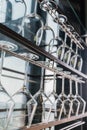 Wine glasses hang up side down on the steel rack. Ready for use Royalty Free Stock Photo