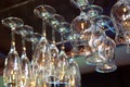 Wine glasses hanging above the bar rack Royalty Free Stock Photo