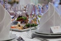 Wine glasses, napkins and salad on the table. Royalty Free Stock Photo