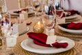 Wine glasses, napkins and salad on the table for the banquet. Royalty Free Stock Photo