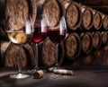 Wine glasses on the old wooden table. Winetasting at the wine cellar Royalty Free Stock Photo