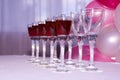 Wine glasses of red wine in row Royalty Free Stock Photo