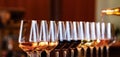 Wine glasses in a row. Pouring wine. Buffet table celebration of wine tasting. Nightlife, celebration and entertainment concept