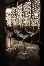 Wine glasses in shelf above a bar rack in restaurant Royalty Free Stock Photo