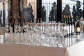 Wine glasses stand on a table in a row. Luxury catering, a beautiful room. Royalty Free Stock Photo