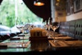 Wine glasses and table setting in restaurant