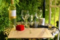 Wine, glasses, wedding rings and marriage contract prepared for a wedding ceremony at a Jewish traditional wedding
