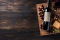 wine, grapes, and a bottle on a black wooden table, sense of luxury and sophistication. purple and green hues Royalty Free Stock Photo