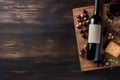 wine, grapes, and a bottle on a black wooden table, sense of luxury and sophistication. purple and green hues of the gra Royalty Free Stock Photo