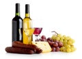 Wine, grapes, cheese an sausage isolated on white Royalty Free Stock Photo
