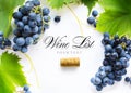 Wine list background; sweet black grapes and bottle cork