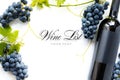 Wine list background; sweet black grapes and red wine bottle Royalty Free Stock Photo