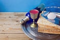 Wine and matzo for Jewish holiday Passover on wooden table Royalty Free Stock Photo