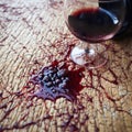 Wine mishap Red wine spills on carpet, creating a stain Royalty Free Stock Photo