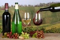 Wine pouring from a bottle into a wine glass Royalty Free Stock Photo