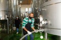 Wine producer controlling production wine, preparing for wine filtration