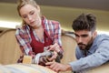 wine producers filling barrel in cellar Royalty Free Stock Photo