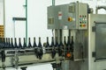 Wine production machine, filling the bottles. Industrial product