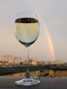 Wine, rainbow, evening, after rain, white wine, glass Royalty Free Stock Photo