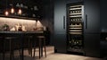 Wine refrigerator in the interior of a black kitchen Royalty Free Stock Photo