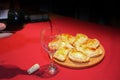 Wine served in a glass with empanadas Royalty Free Stock Photo