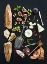 Wine and snack set. Baguette, glass of white, figs Royalty Free Stock Photo